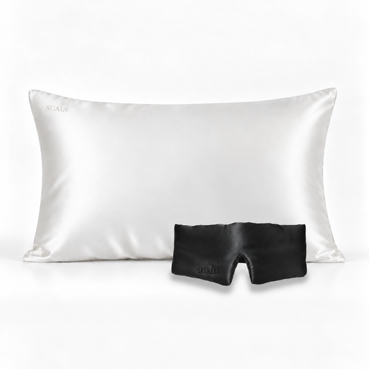 Ivory White silk pillowcase with a Midnight Black silk sleep mask