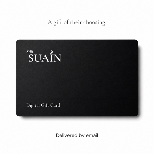 Still Suain Digital Gift Card, presented as a matte black card. Delivered by email.